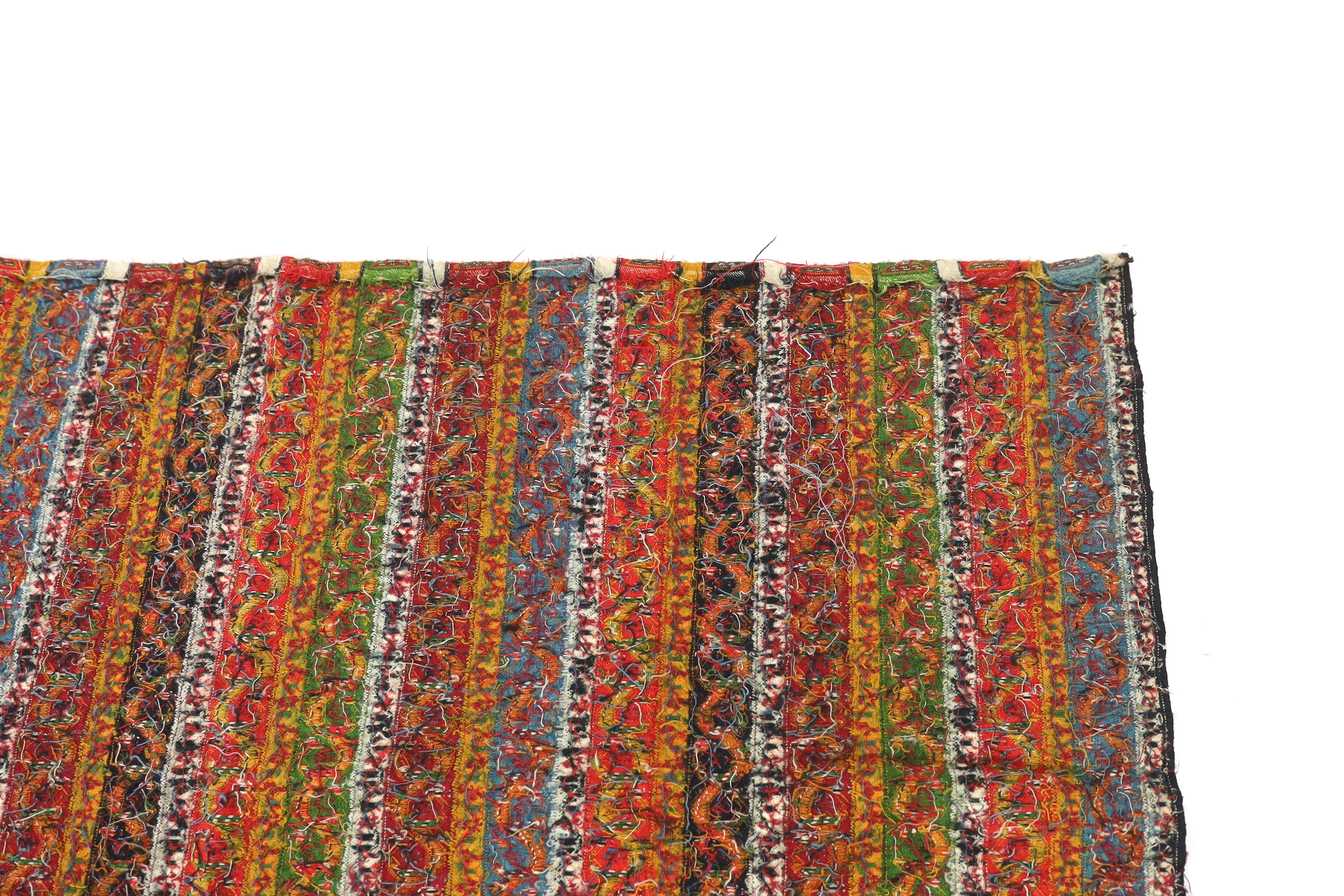 A 19th century Kashmir, multi coloured, striped twill, woven wool shawl, with the fringe cut one end, 140cm long x 114cm wide